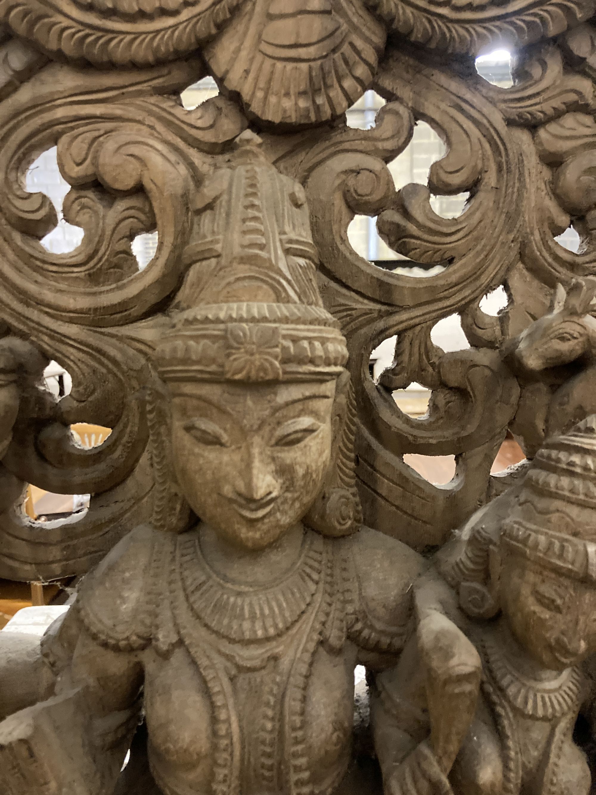 An Indian carved wood deity, width 50cm, depth 15cm, height 90cm